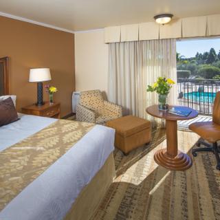 Best Western Plus Royal Oak Hotel | San Luis Obispo, California | One king bed with seating area and pool view